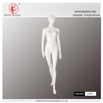 Abstract walking female mannequin in gloss white