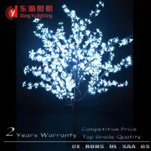 outdoor white metal lighted christmas tree with cherry blossom