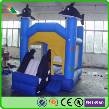 PVC tarpaulin dolphin bouncing castles with slide and jumping