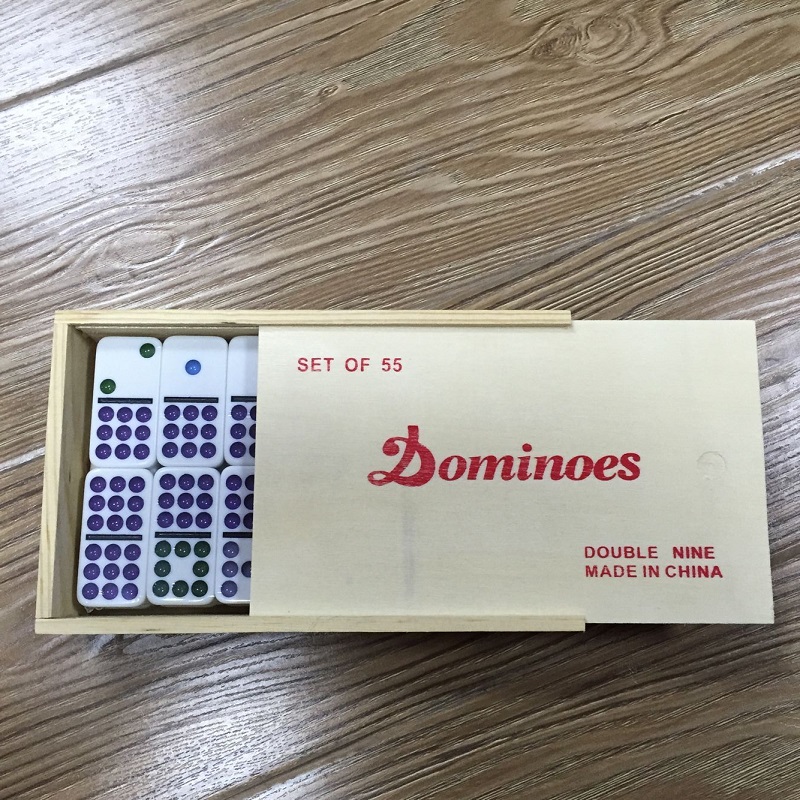 white color dominoes in wooden box