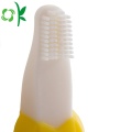 Líquido de limpeza amarelo macio da escova de dentes infantil do silicone para o dente