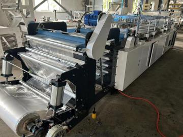 Fully automatic disposable raincoat making machine