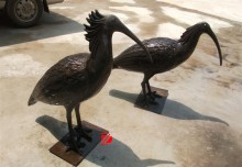 bronze water birds statue