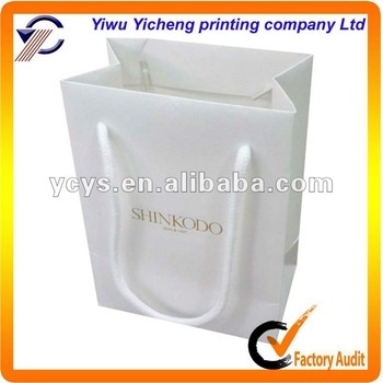 Small white decorative paper bags