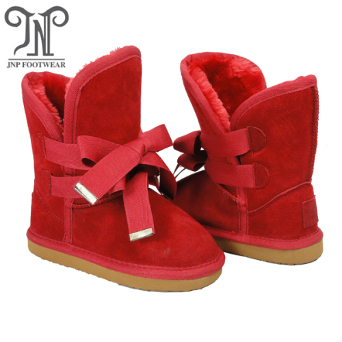 เด็กผู้หญิงฤดูหนาวสูงสีแดงรองเท้าบู๊ทสีแดง