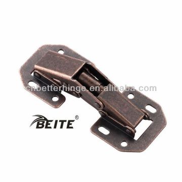 Spring loaded hinges for wooden cabinet door