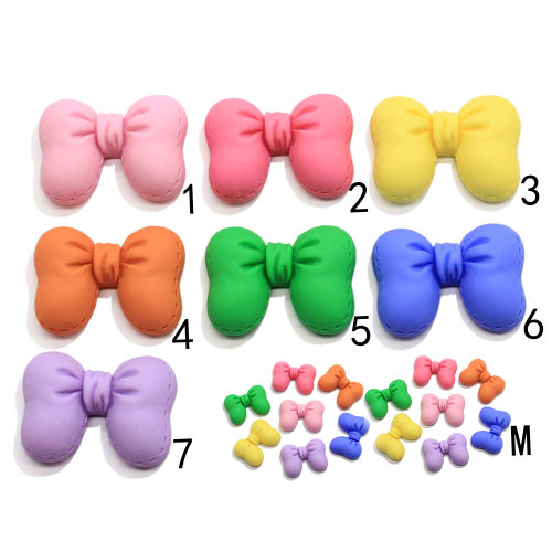 Venta al por mayor Pretty Bowknot resina Flatback Beads Artificial DIY decoración pajarita accesorio de adorno hecho a mano