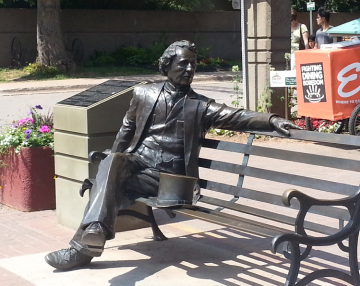 garden outdoor sculptures western micro metal statue sitting man