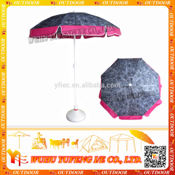 Beach umbrella with storage pocket