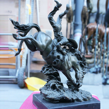 Small size indoor antique bronze cowboy on a horse statue with marble base