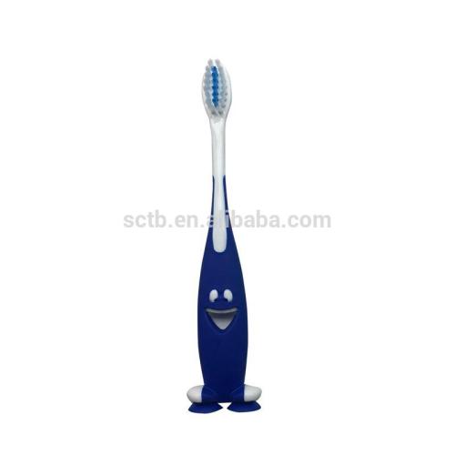 Brosse à dents enfant de bébé de poils doux heureux visage avec ventouse