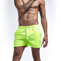 Short de natation des hommes verts fluorescent en gros