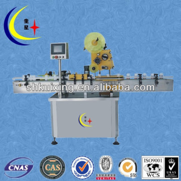 Automatic labeling machine for bottle body and cap
