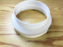 Injection-molded part - One-piece machine exhaust duct joint