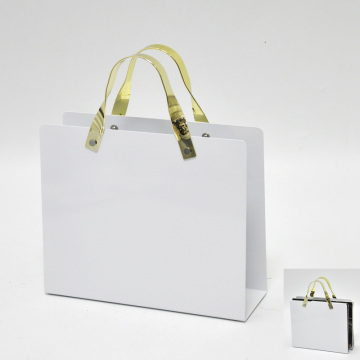 Bag shape handle table magazine rack