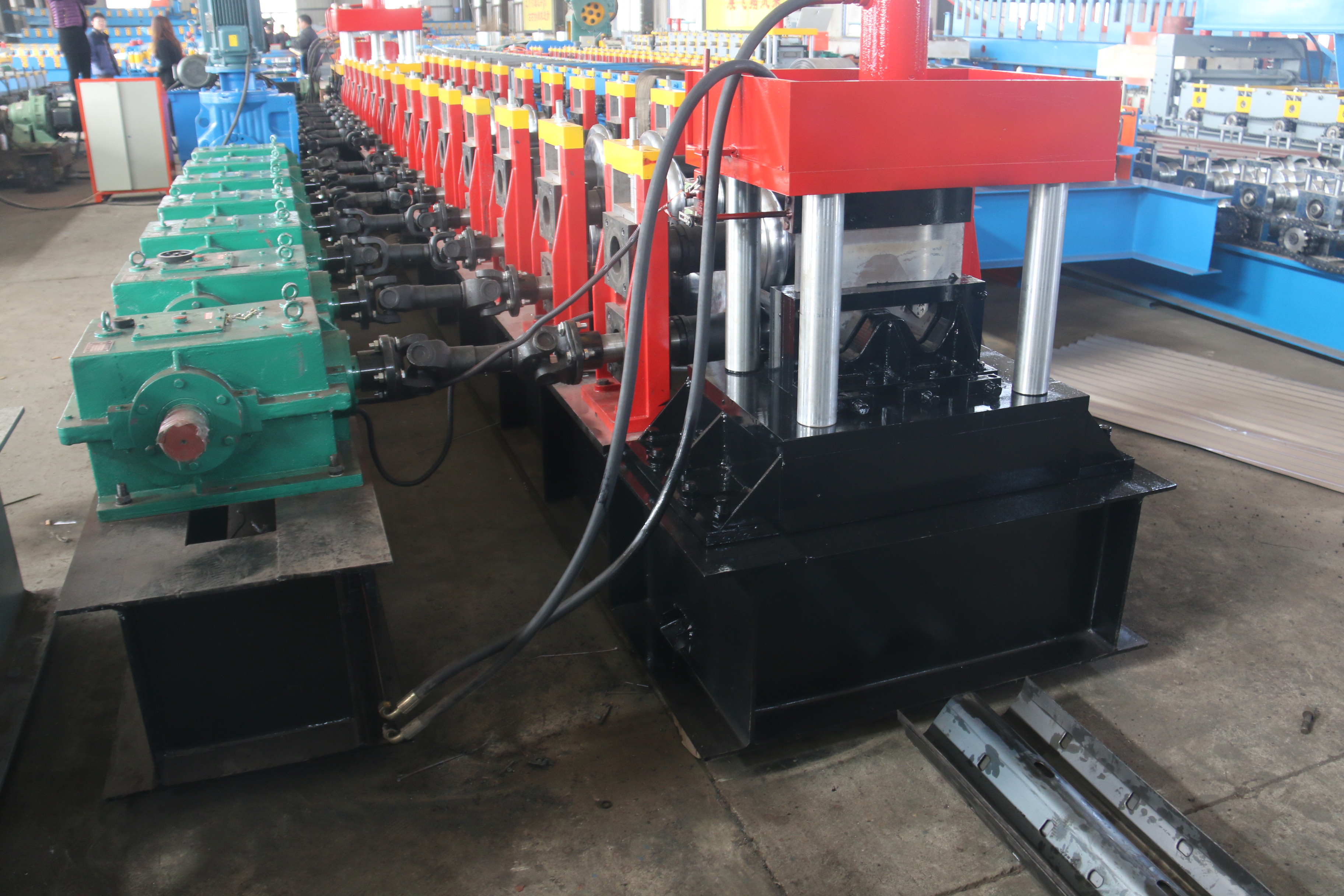 Highway barrier making machine with punching holes