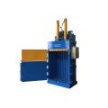 Vertical hydraulic baling machine for waste paper