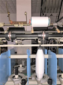 Rimless take-up Bobbin two for one twister