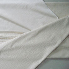 Embossed short pile fabric, knitted