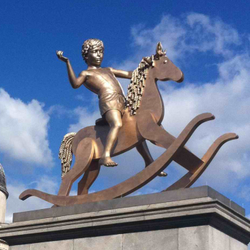 Large brass casting bronze little boy on a rocking horse sculpture for outdoor decoration