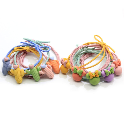 100 Pcs Bande Dessinée De Couleur De Bonbons Filles Élastiques Cravates Bande De Cheveux De Bébé Fille Bandeau Titulaires De Queue De Cheval Bracelet Accessoires De Cheveux