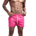 Les shorts classiques roses masculins prennent en charge le logo personnalisé