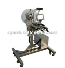 Cap labeling machine