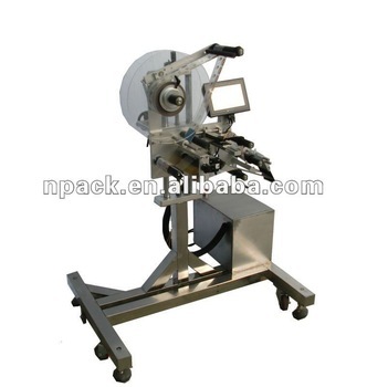 Cap labeling machine