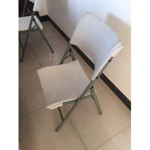 Folding plastic white chairs