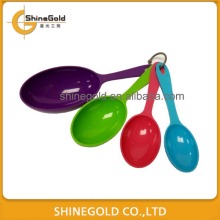 Colourful plastic measuring spoon