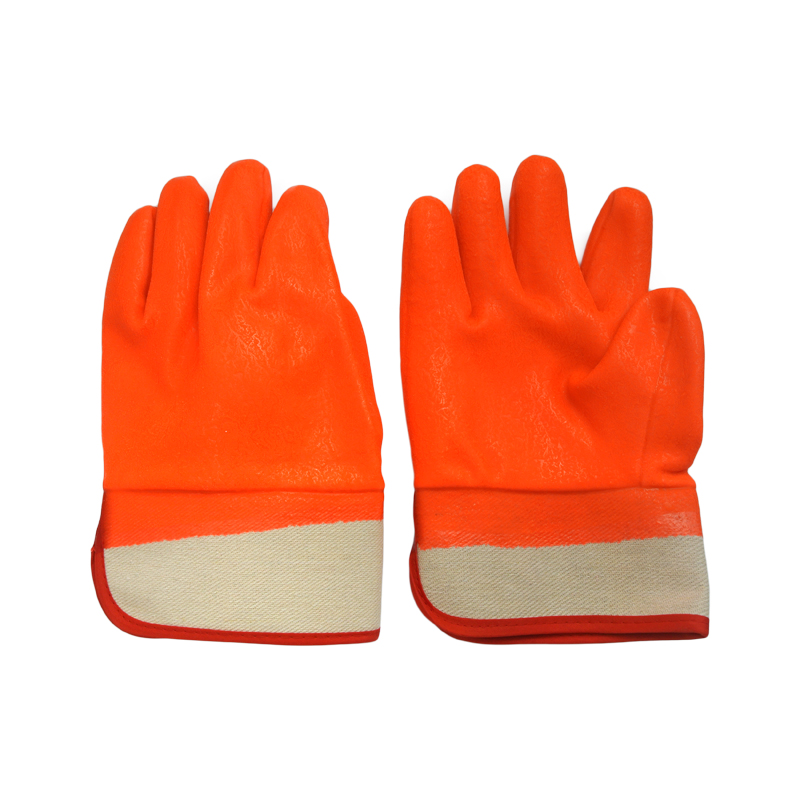 Fluoreszierender orange. Kalter PVC-beschichteter Handschuh