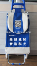 blue fabric supermarket shopping trolley in blue handle