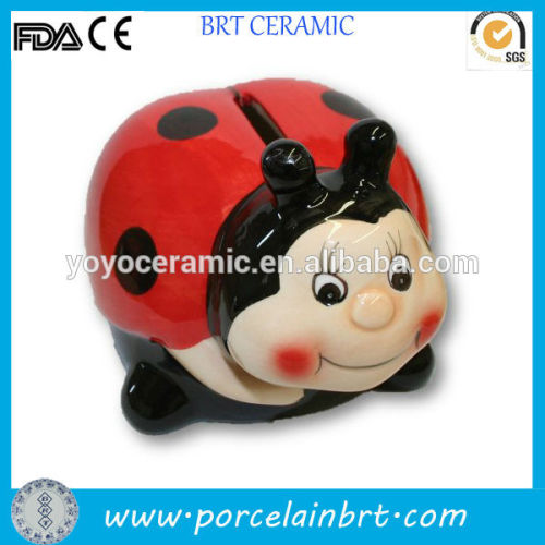 red ceramic ladybug money box for children