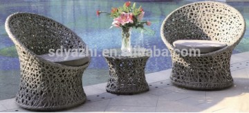 combined table and chair in round shape in white wicker color