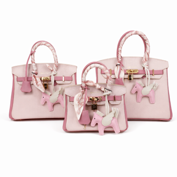 Lady's light pink genuine leather handbag