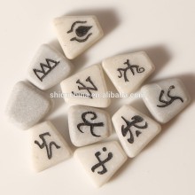 white marble stone engraved with game rune