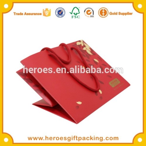 Trade Assurance Gold Foil Hot Stamping Logo Red Color Paper Bag For BY-HEALTH Product