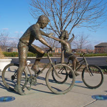 bronze foundry father and daughter bicycle sculpture in Westerville