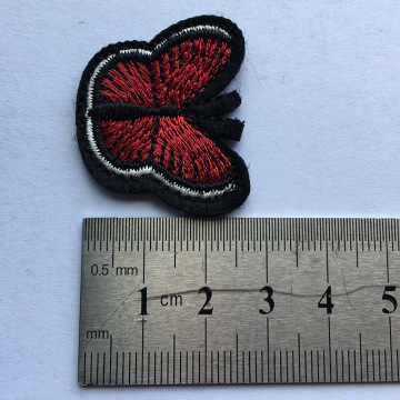 Red butterfly embroidered lavalava patch faʻapipiʻi aganuu