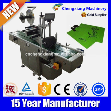 CE Certificate automatic bag label applicator,plastic bag label applicator,overhead plastic bag label applicator