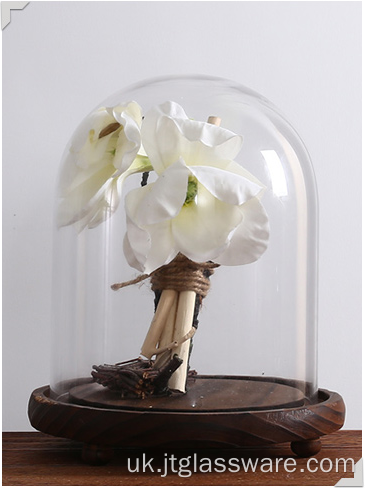 Прозорий скляний дзвін купол з квіткою