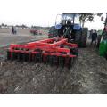 Disc ploughs harrows farmland Tractor