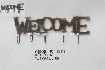 Wall decorative welcome metal hooks, Decorative metal hooks in font design, Rusty metal wall hooks