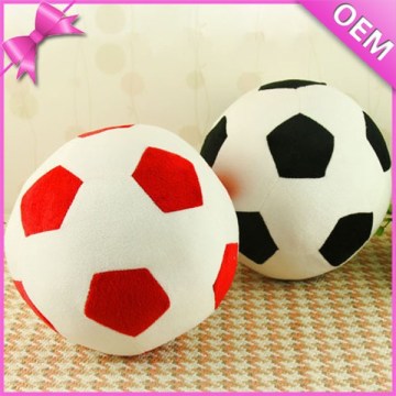 Kid playing soft soccer ball plush toy, plush stuffed soccer ball