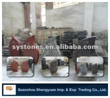 red headstone with trees