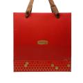 Kırmızı altın logo baskılı kumaş giysi alışveriş çantaları