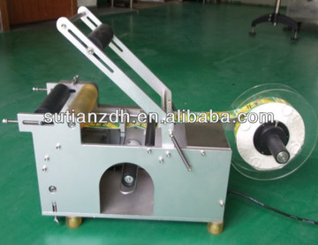 MT-50 semi-automatic adhesive round bottle labeler