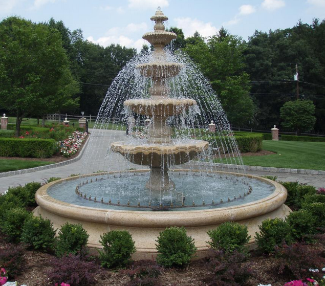 hand carved stone wall fountain