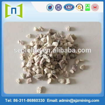 Cation exchange white zeolite stone