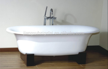 freesanding cast iron bath tub with wooden cradles